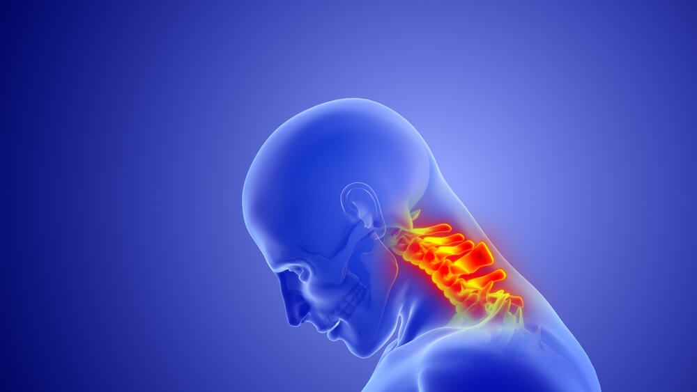 A doctor feeling a patient's bandaged knee